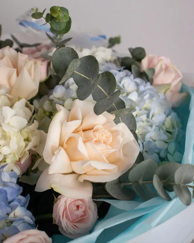 Pastel bouquet with roses, hydrangeas, and eucalyptus