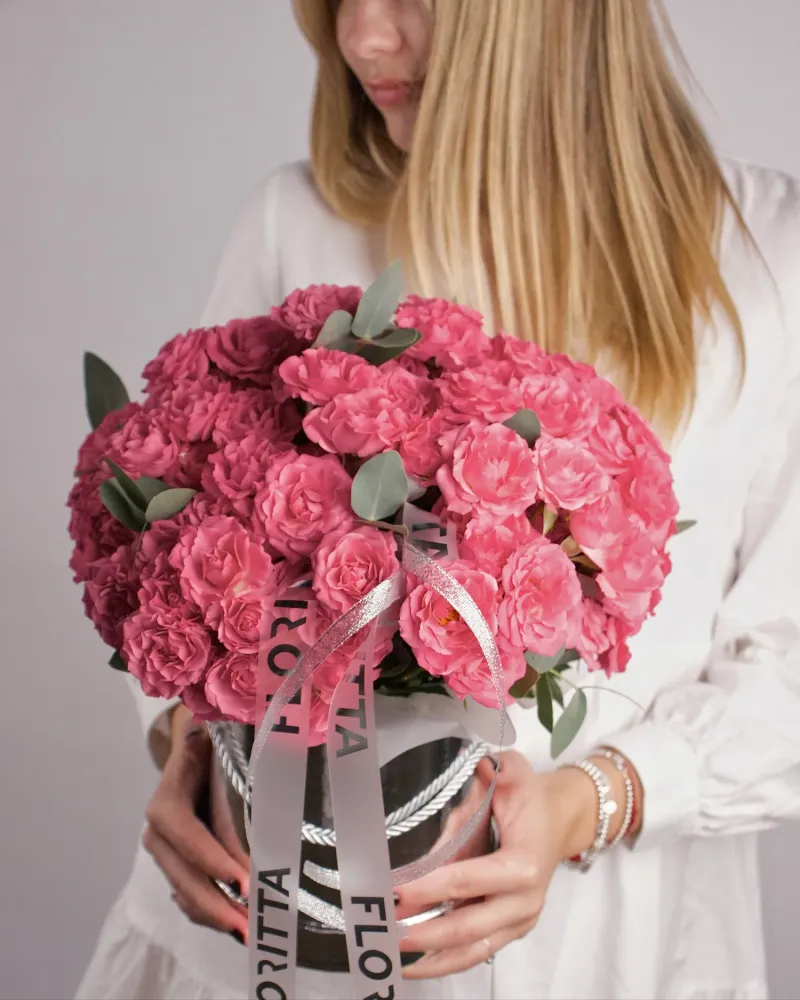 Vibrant pink rose bouquet in elegant metallic box