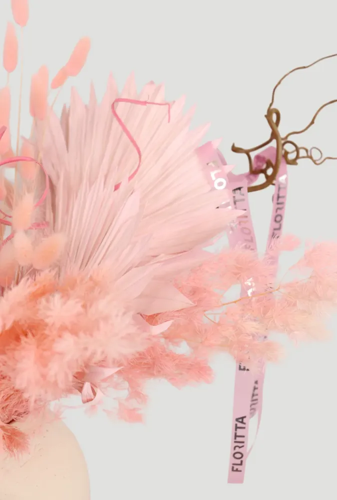 Dried floral arrangement in soft pink & beige tones
