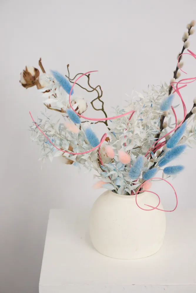Contemporary dried flower arrangement with cotton, blue pampas, and pink ribbon — Floritta