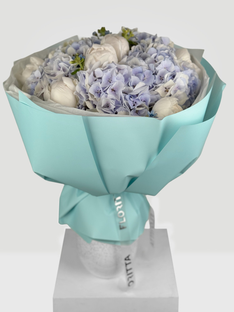 Full lavender hydrangea and white peony wrapped in turquoise paper — Floritta