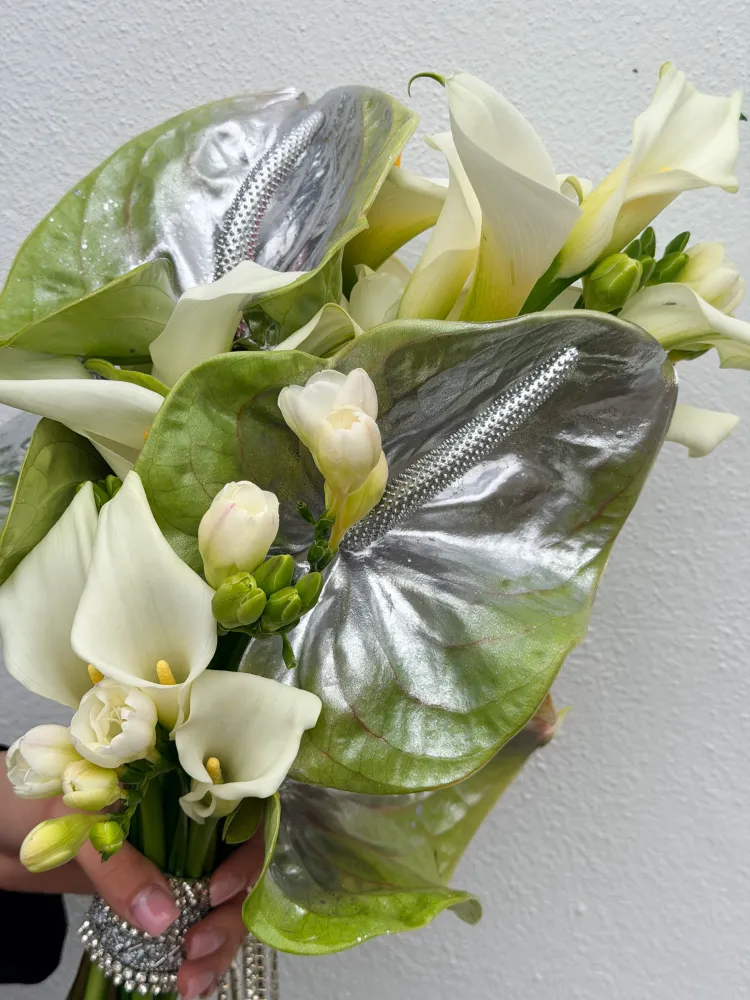 Modern white and yellow florals with grey-green anthurium in pearled wrap — Floritta