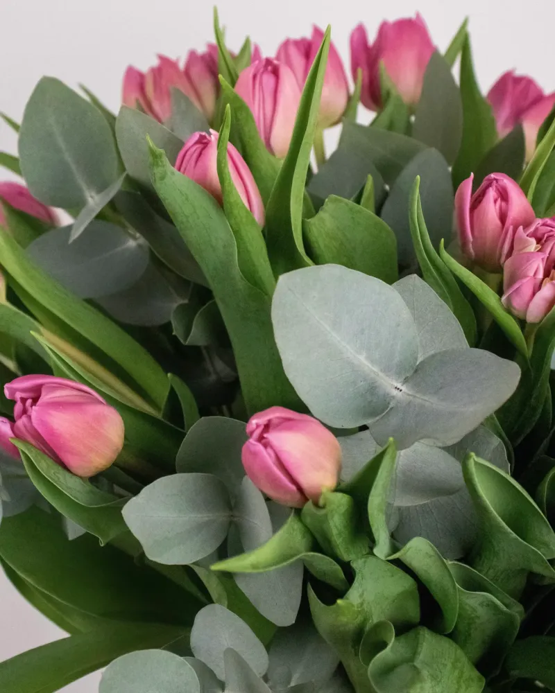 Delightful tulip and eucalyptus arrangement