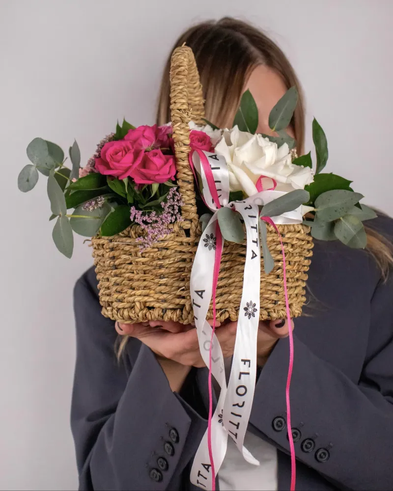 Florist-designed pink and white rose basket arrangement with Floritta branding
