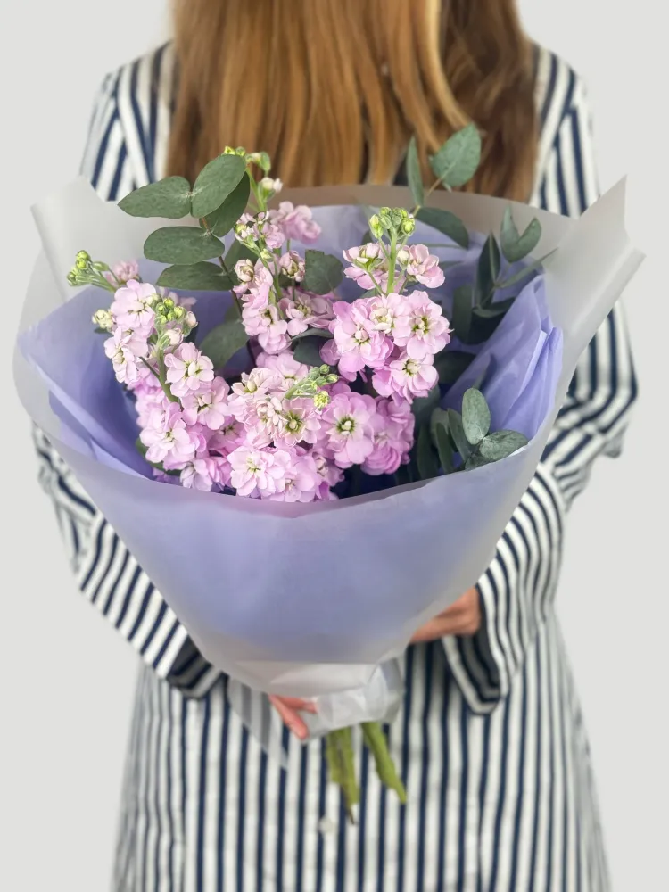 Soft pink stock and eucalyptus hand-tied bouquet in lavender wrap — Floritta