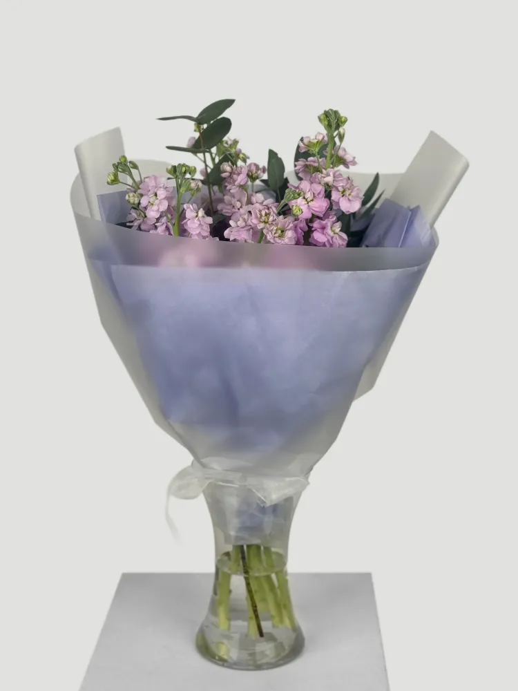 Pink stock arrangement in tissue wrap with vase display — Floritta