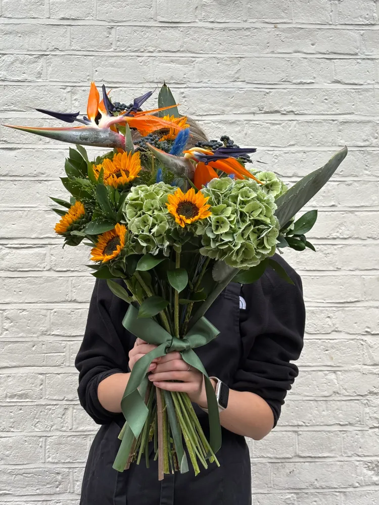 Vibrant Bird of Paradise, gerbera and hydrangea bouquet with sage ribbon — Floritta