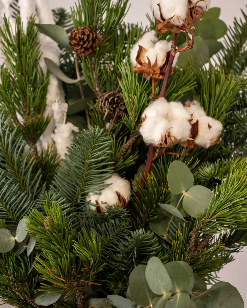 Christmas greenery bouquet with snowy accents