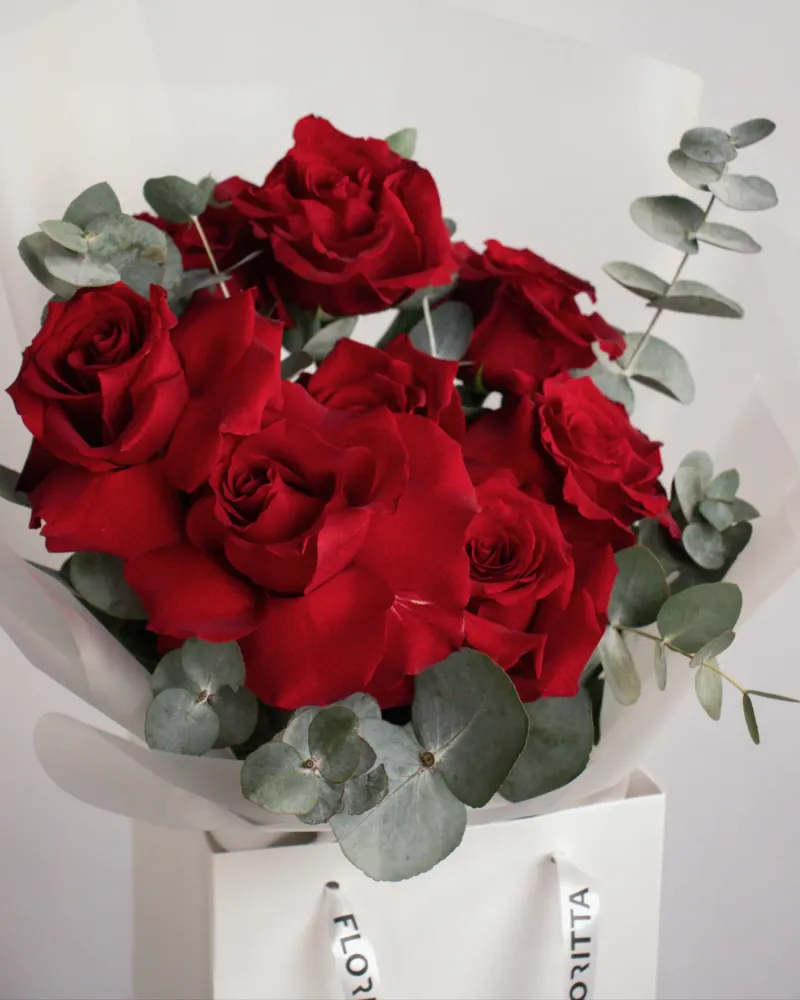 Luxurious red rose bouquet with eucalyptus in white Floritta presentation box