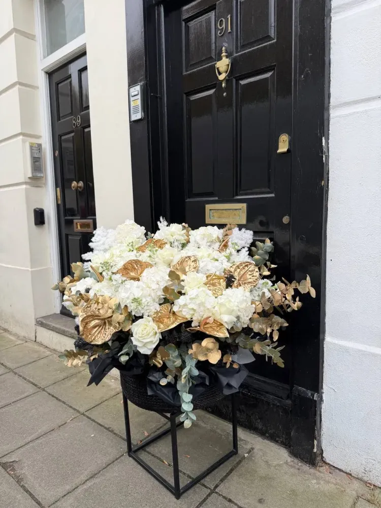Full premium arrangement in black urns with white florals and metallic leaves — Floritta