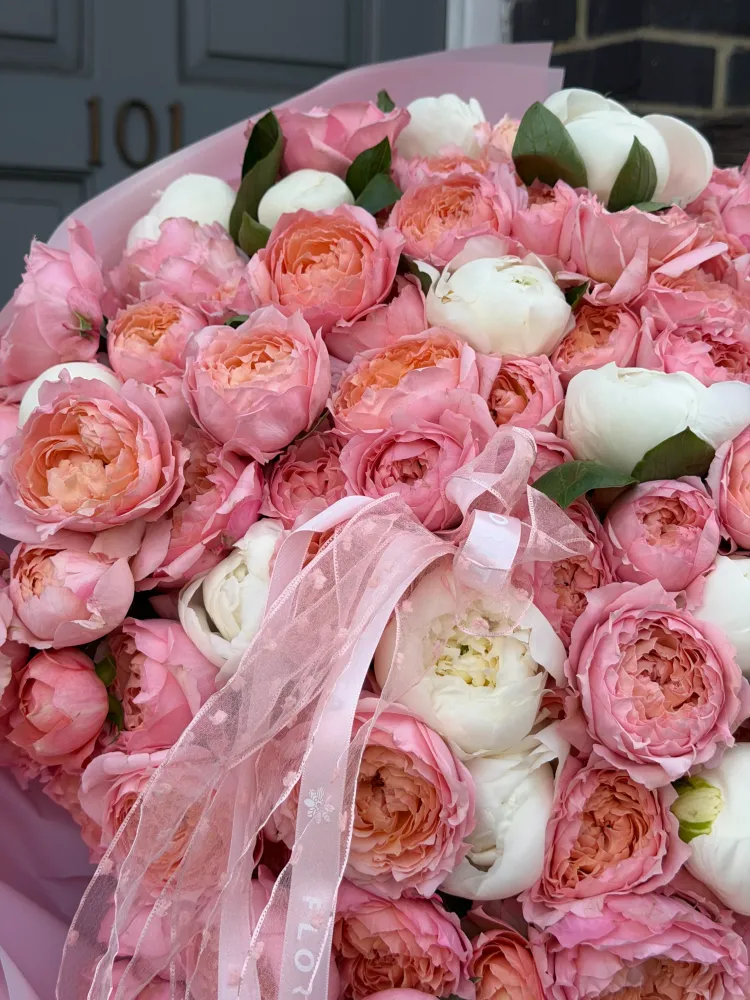 Opulent pink and cream rose arrangement with tissue wrap — Floritta London