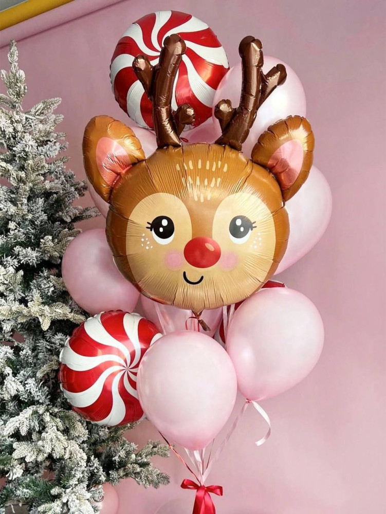 Festive reindeer balloon arrangement with frosted greenery and candy details — Floritta