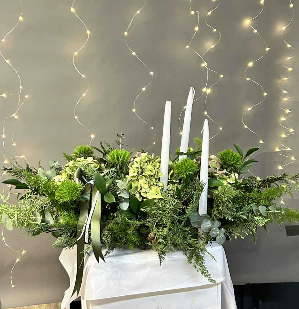 Cream hydrangea and foliage centrepiece with white candles in white planter — Floritta