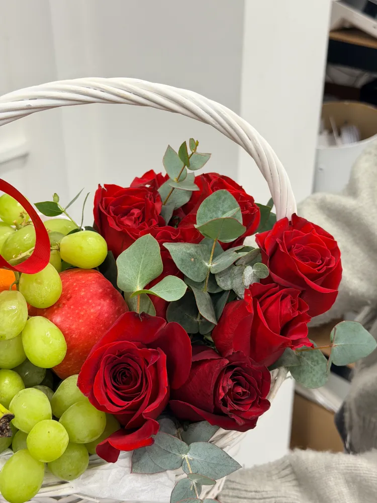 Fruits and roses in the basket