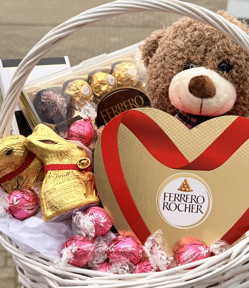 Sweets and teddy in the basket