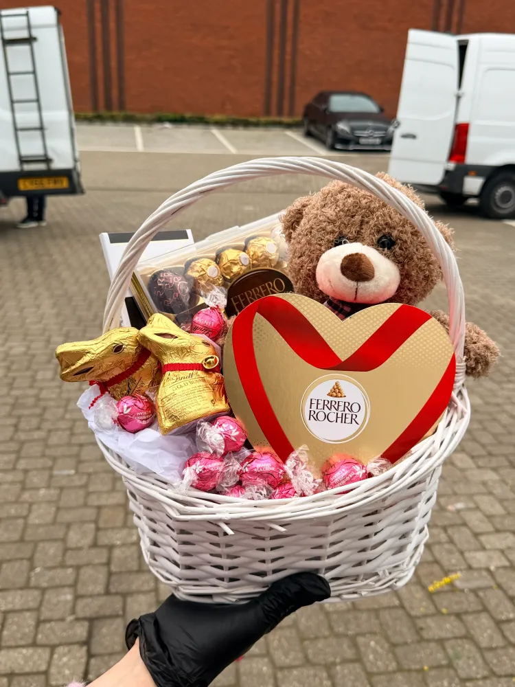 Sweets and teddy in the basket
