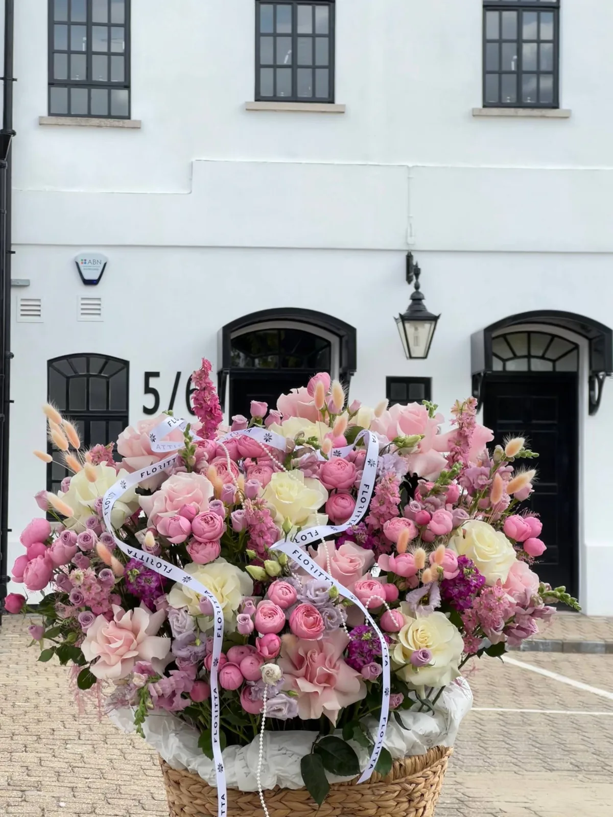Pastel stillness floral basket (roses, eustomas & spray roses)