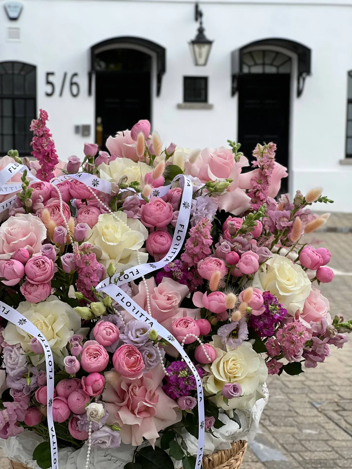 Pastel stillness floral basket (roses, eustomas & spray roses)