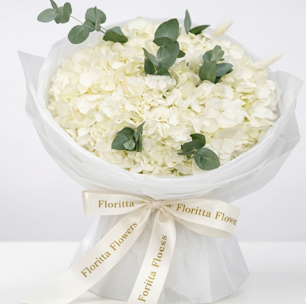 Luxe cream hydrangea and eucalyptus bouquet in white box — Floritta