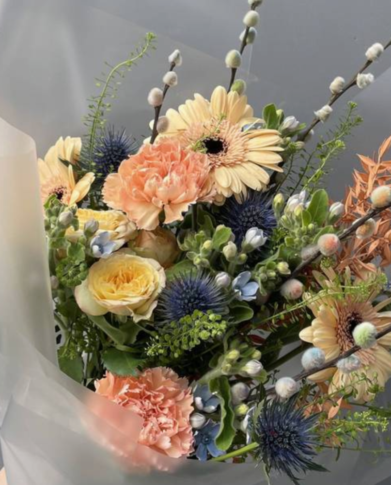 Rainbow (gerberas. carnations;, roses, spray roses, greneery)