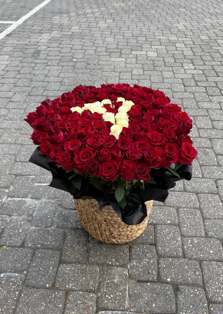 Bespoke red rose arrangement with cream monogram detail in woven basket — Floritta
