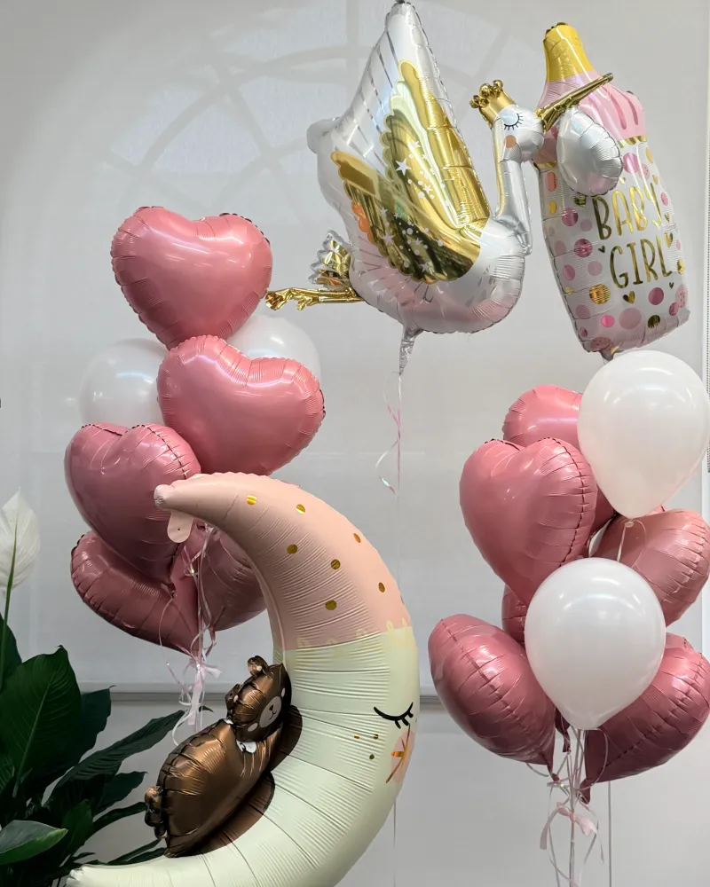 Celebration balloon arrangement with pink hearts, gold accents and character balloons — Floritta