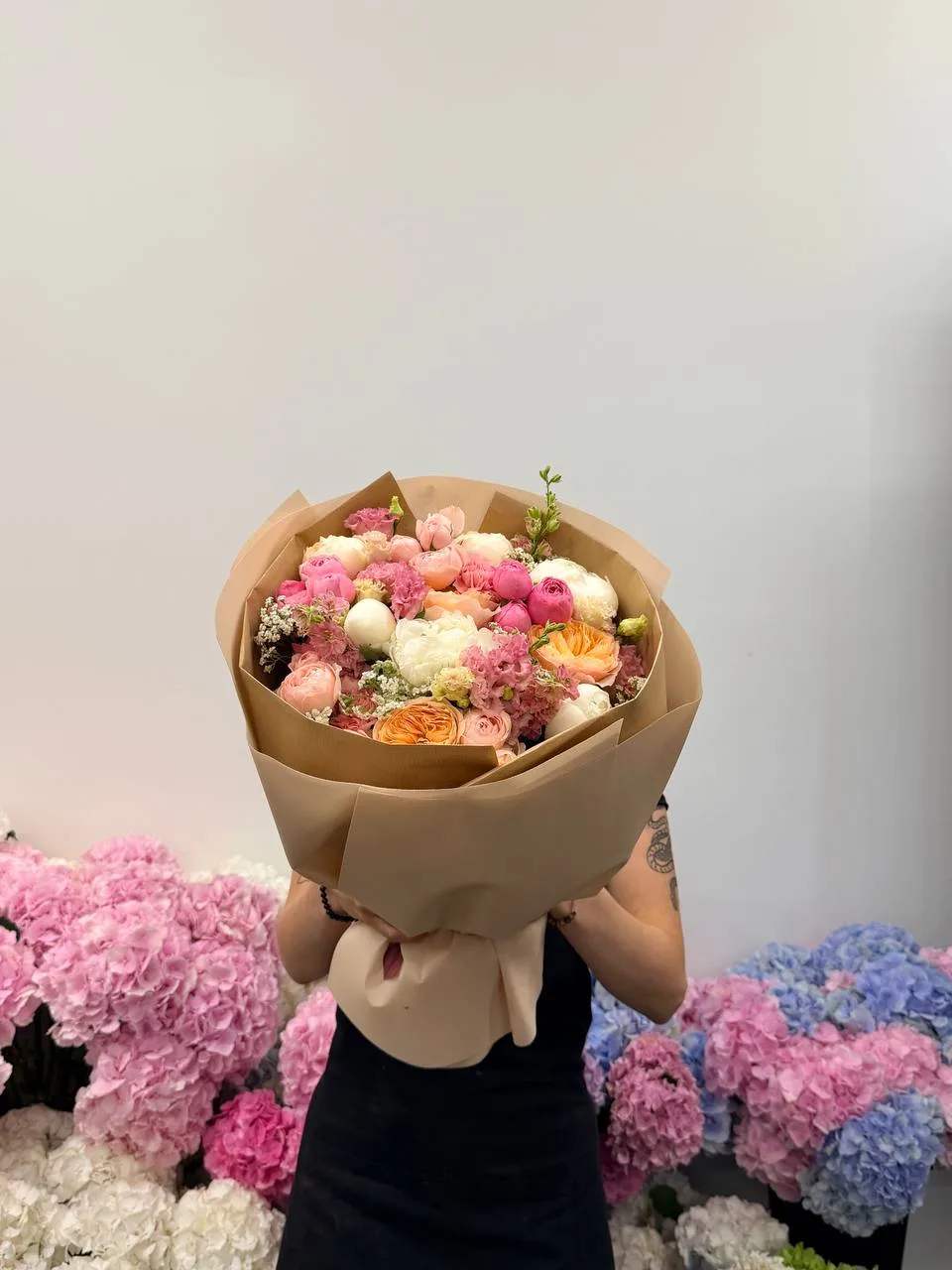 Peach garden posy (spray roses, peony roses & lisianthus)