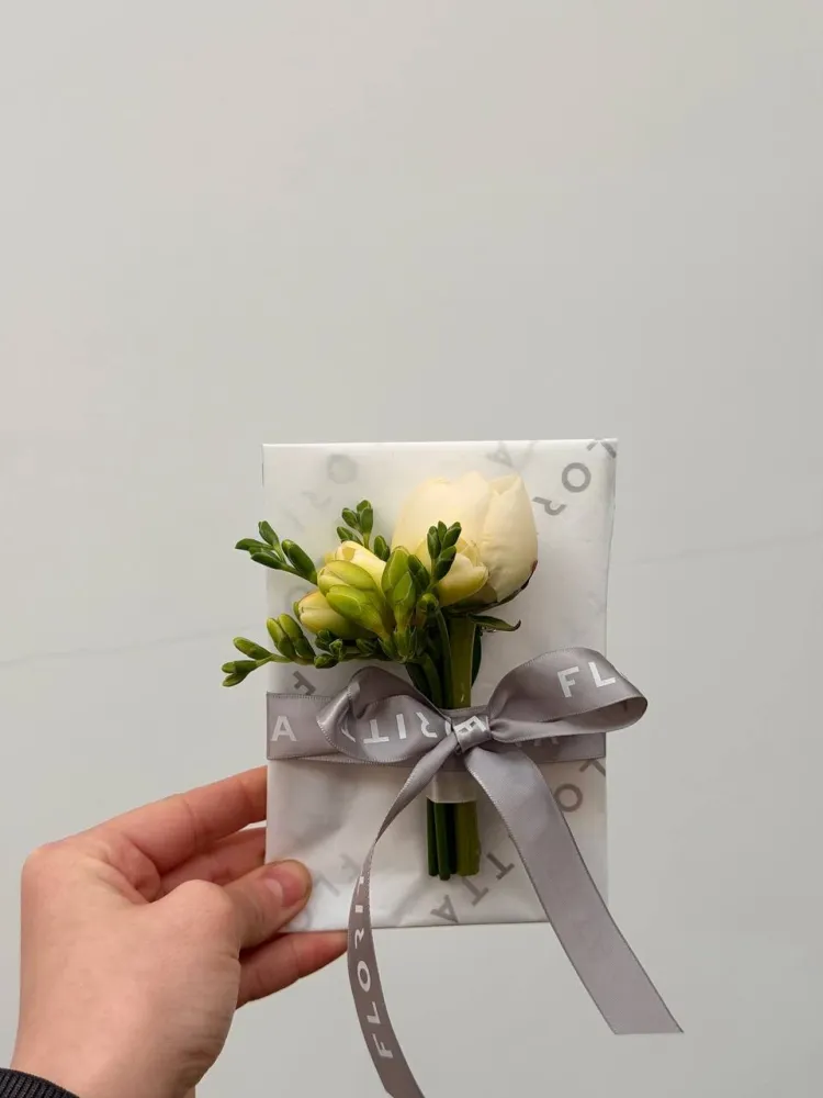 Cream roses and yellow hypericum buds with grey Floritta ribbon bow