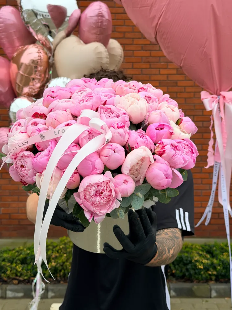 50 pink peonies in cream and black basket with eucalyptus greenery, Floritta luxury arrangement.