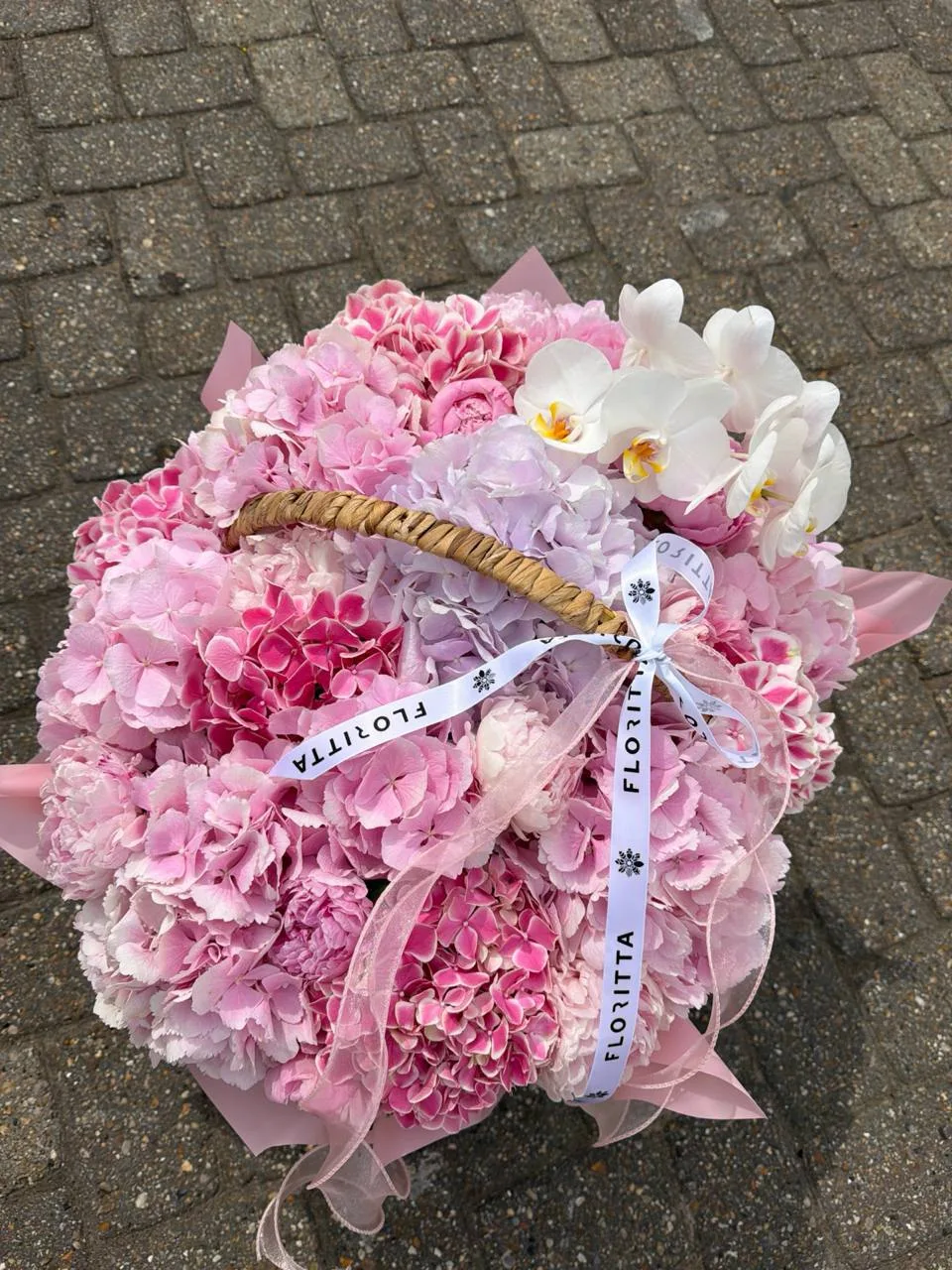 Pink hydrangea basket bouquet (hydrangeas, orchids, roses)