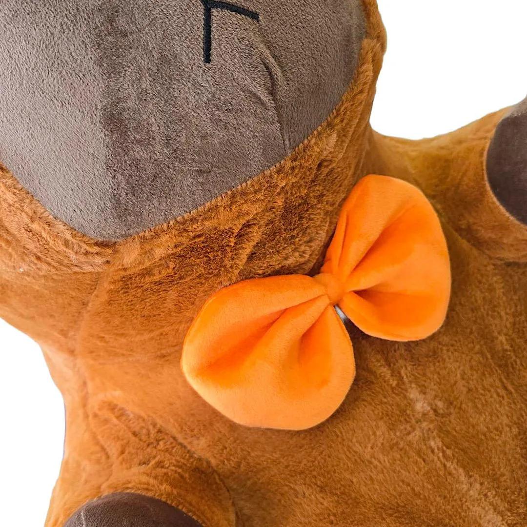 Cuddly capybara plush with orange bow tie