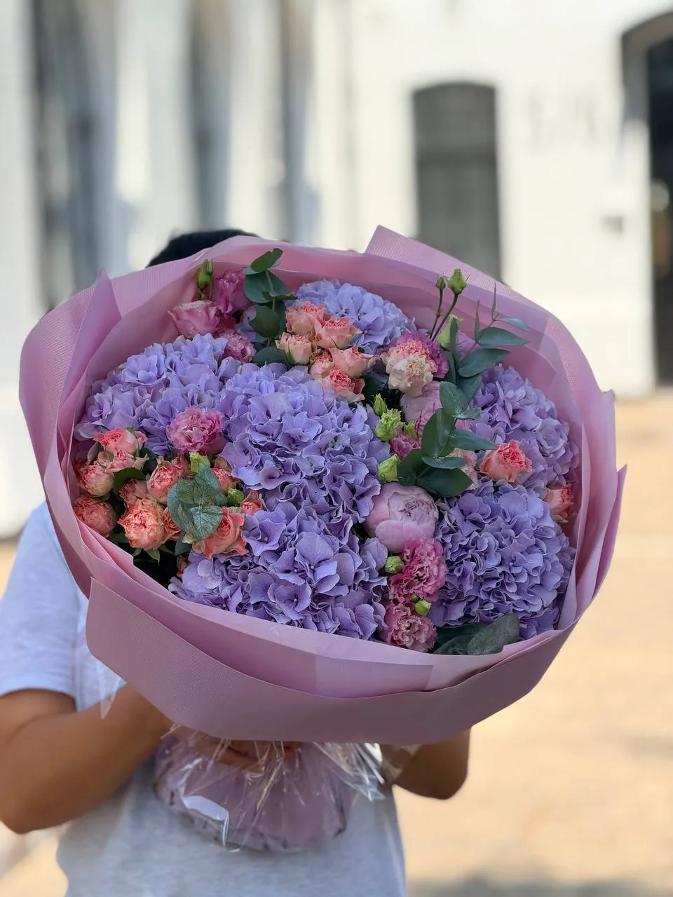 Lavender Hill (lilac-purple hydrangeas, coral peony spray roses, lisianthus, eucalyptus)