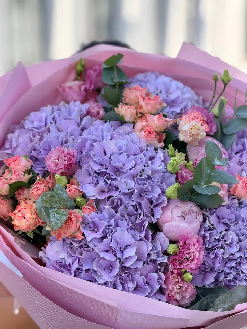 Lavender Hill (lilac-purple hydrangeas, coral peony spray roses, lisianthus, eucalyptus)