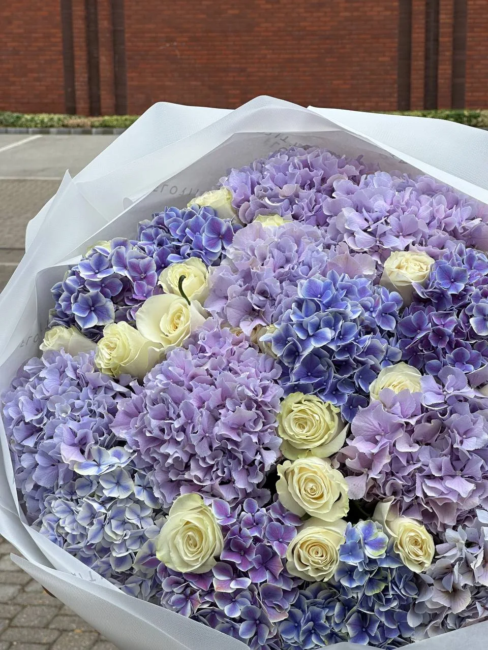 Periwinkle hydrangea bouquet with ivory garden roses