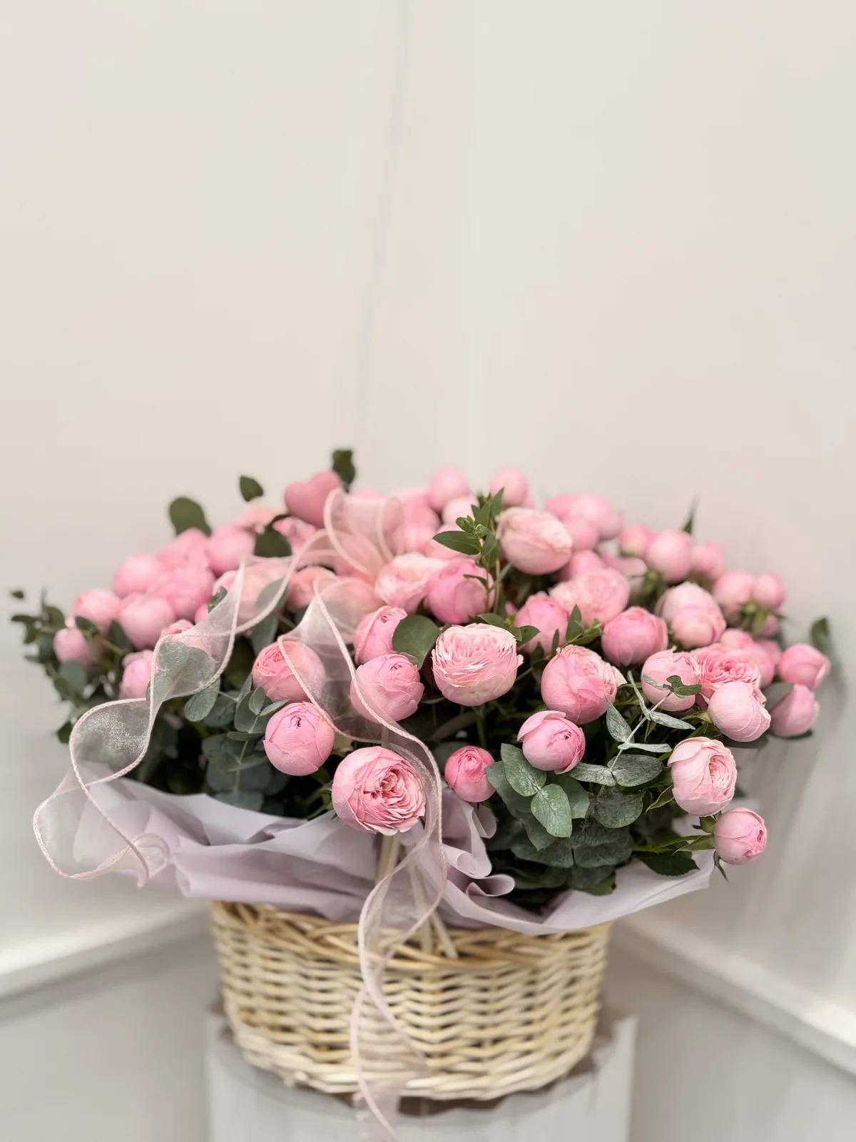 Pink peony spray rose basket with eucalyptus