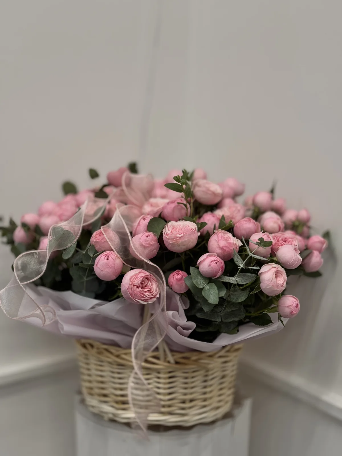 Pink peony spray rose basket with eucalyptus