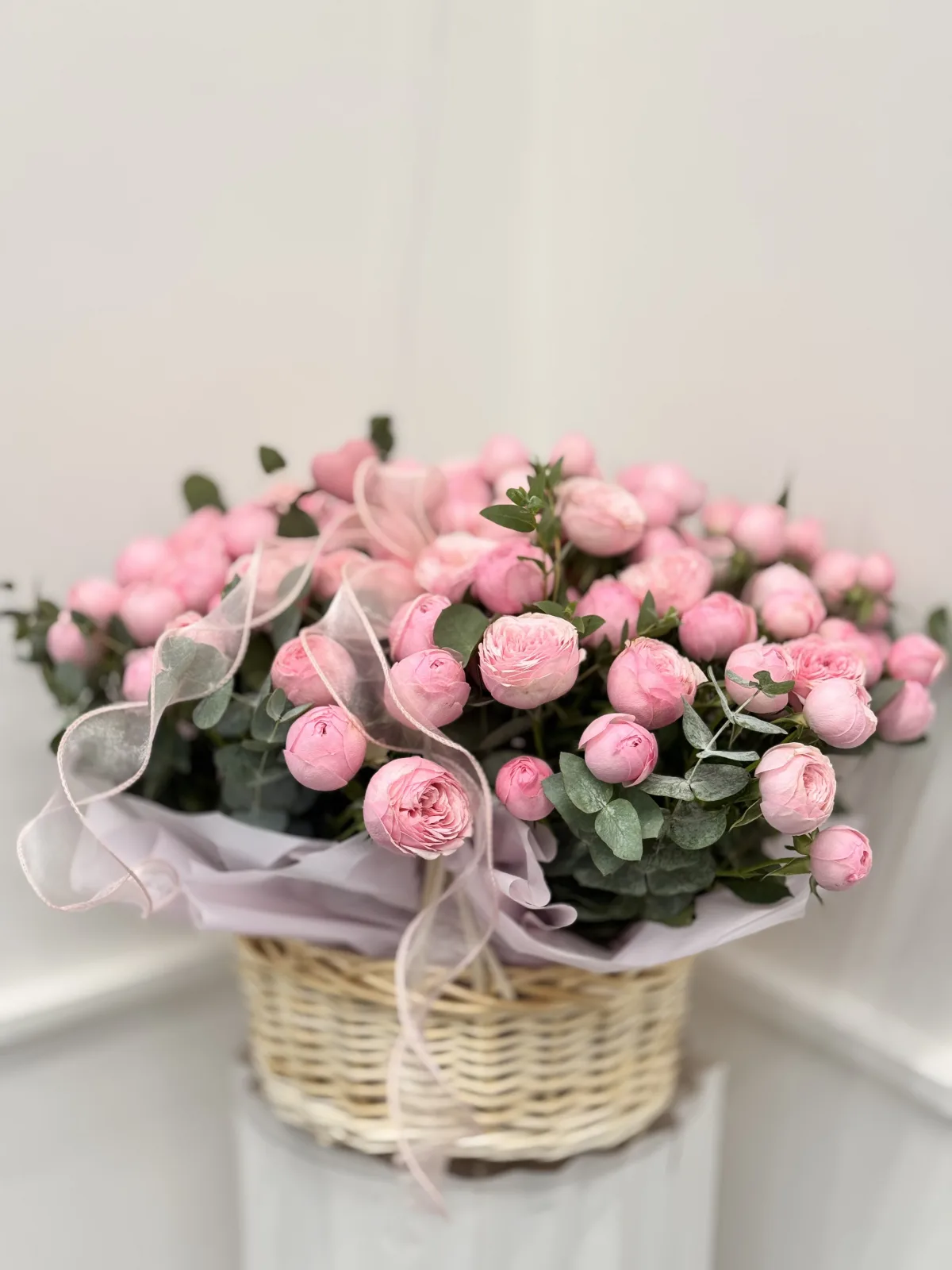 Pink peony spray rose basket with eucalyptus