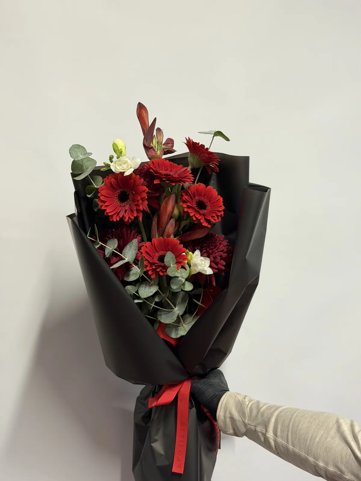 Garnet noir bouquet (gerberas, lisianthus & eucalyptus)