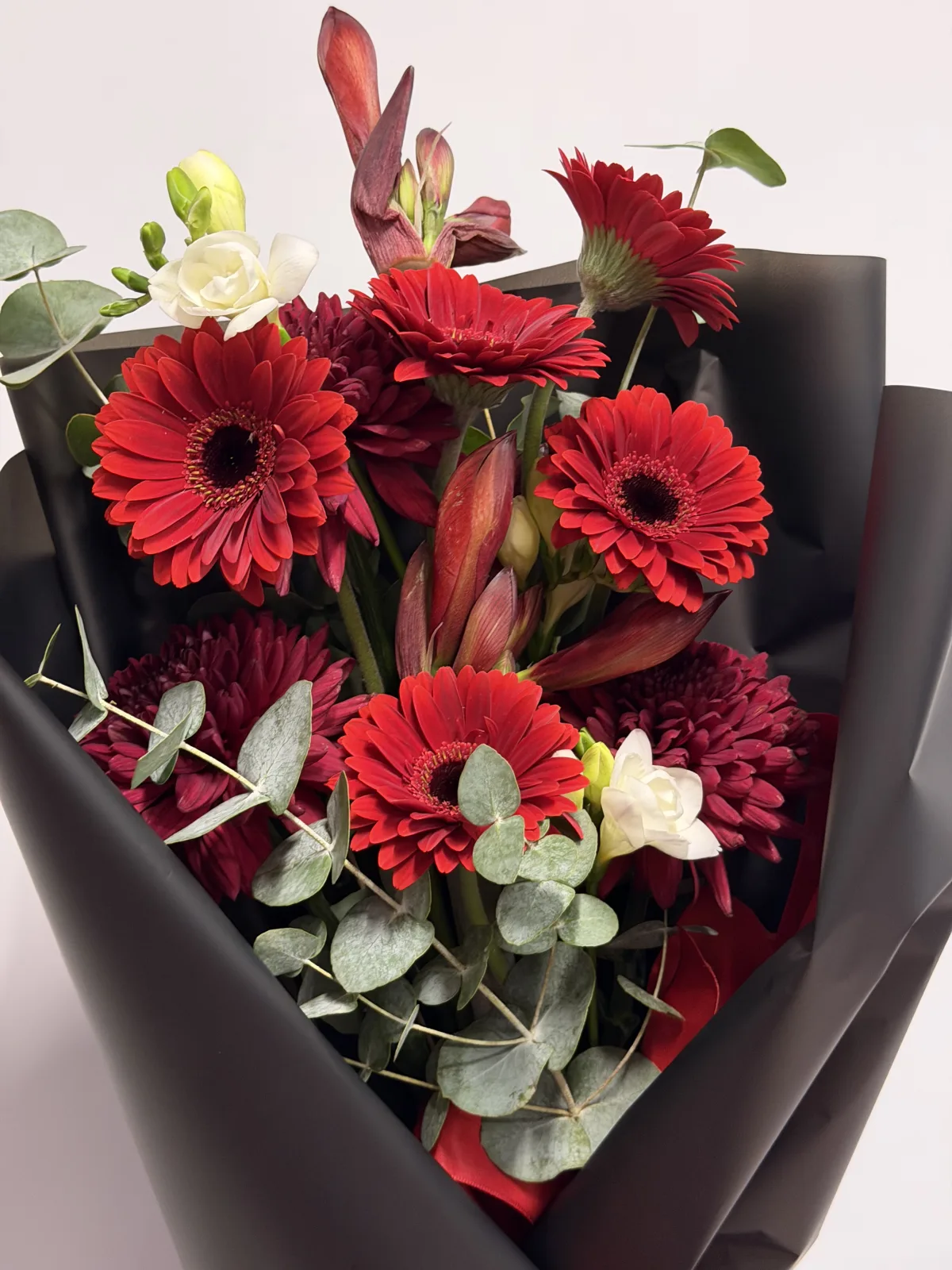 Garnet noir bouquet (gerberas, lisianthus & eucalyptus)