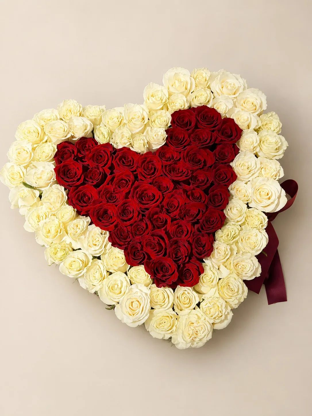 Ivory-framed red rose heart arrangement