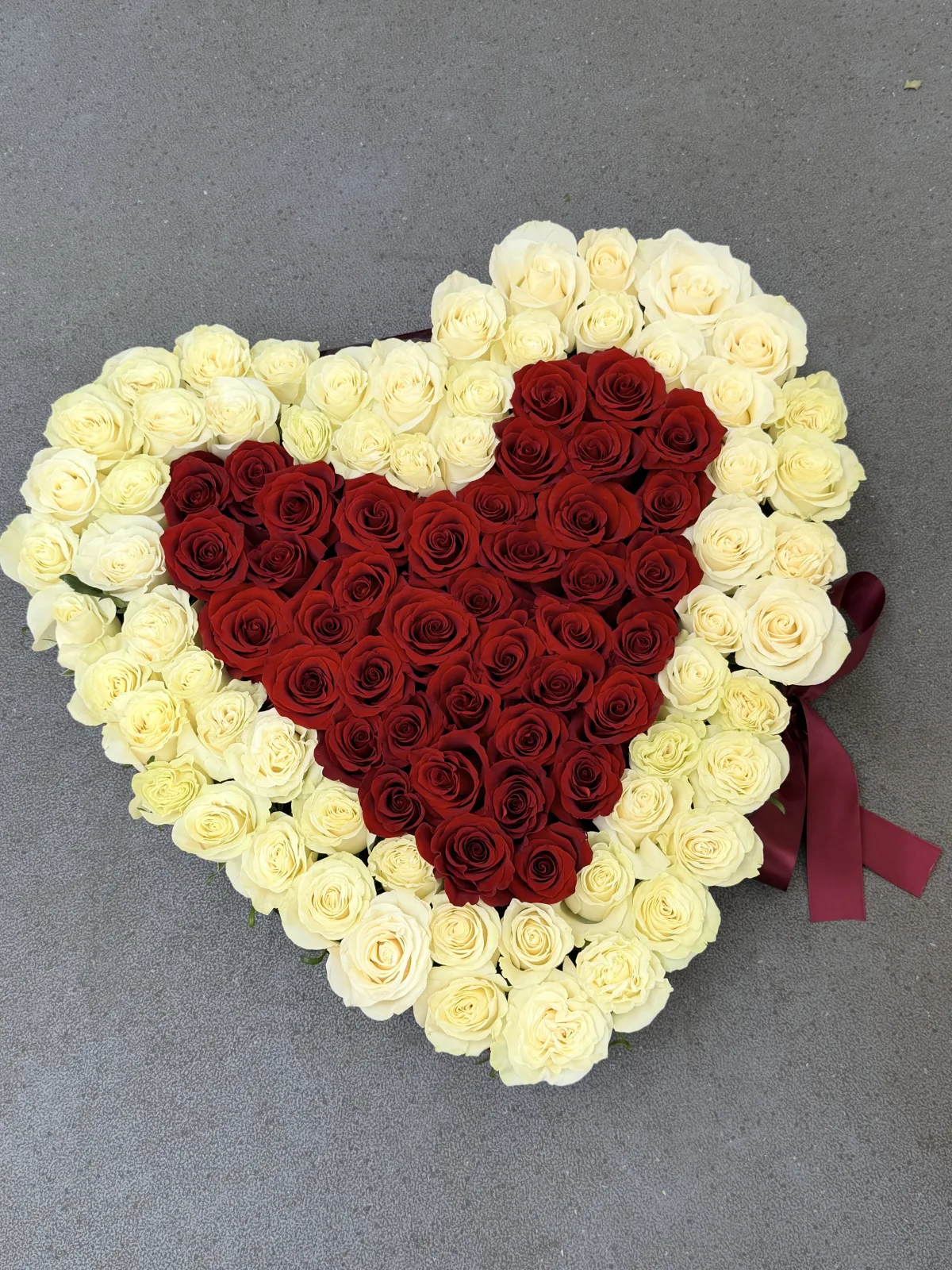 Ivory-framed red rose heart arrangement