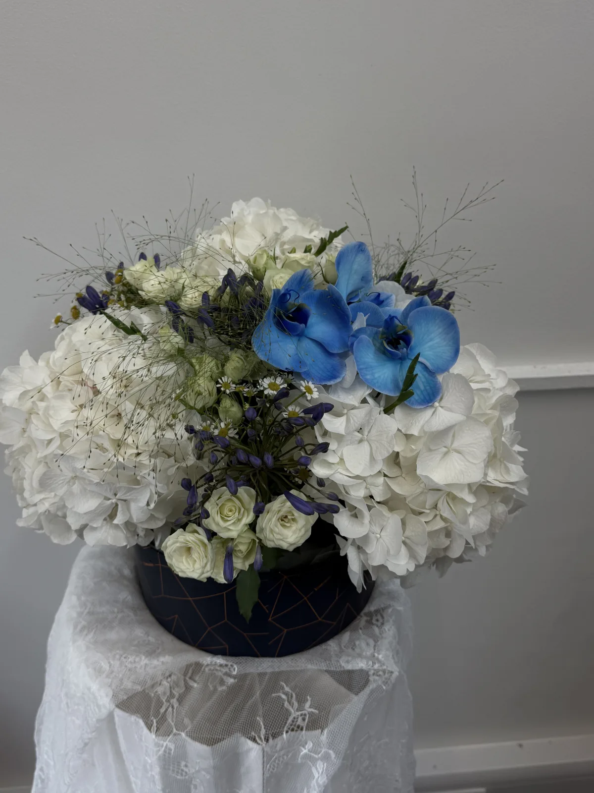 Blue orchid & white hydrangea bowl arrangement