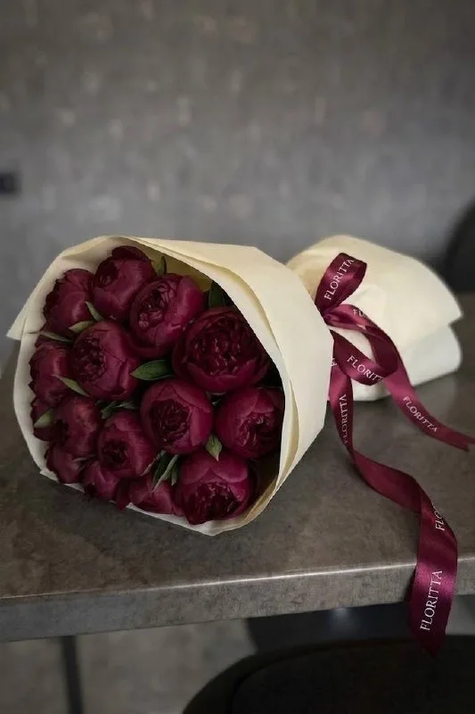 18 burgundy peonies in ivory wrap